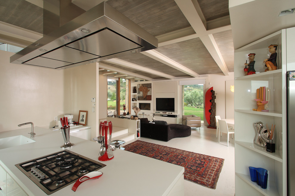 Esempio di una grande cucina design con lavello integrato, ante bianche, top in superficie solida e pavimento in gres porcellanato