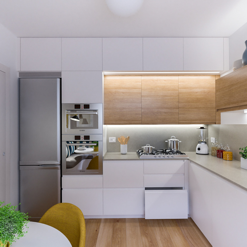 Example of a mid-sized danish l-shaped light wood floor open concept kitchen design with a single-bowl sink, flat-panel cabinets, white cabinets, quartz countertops, beige backsplash, quartz backsplash, stainless steel appliances, no island and beige countertops