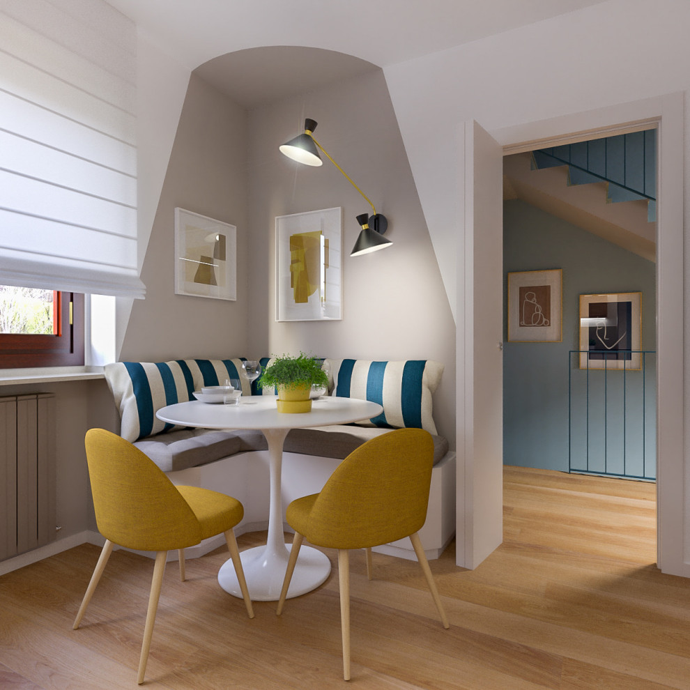 Ispirazione per una sala da pranzo aperta verso il soggiorno scandinava di medie dimensioni con parquet chiaro