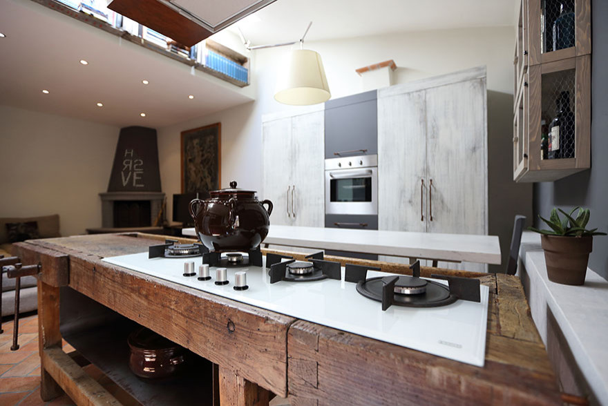 Design ideas for an expansive farmhouse single-wall open plan kitchen in Other with a built-in sink, flat-panel cabinets, purple cabinets, granite worktops, brown splashback, wood splashback, terracotta flooring, an island, orange floors, white worktops and a drop ceiling.