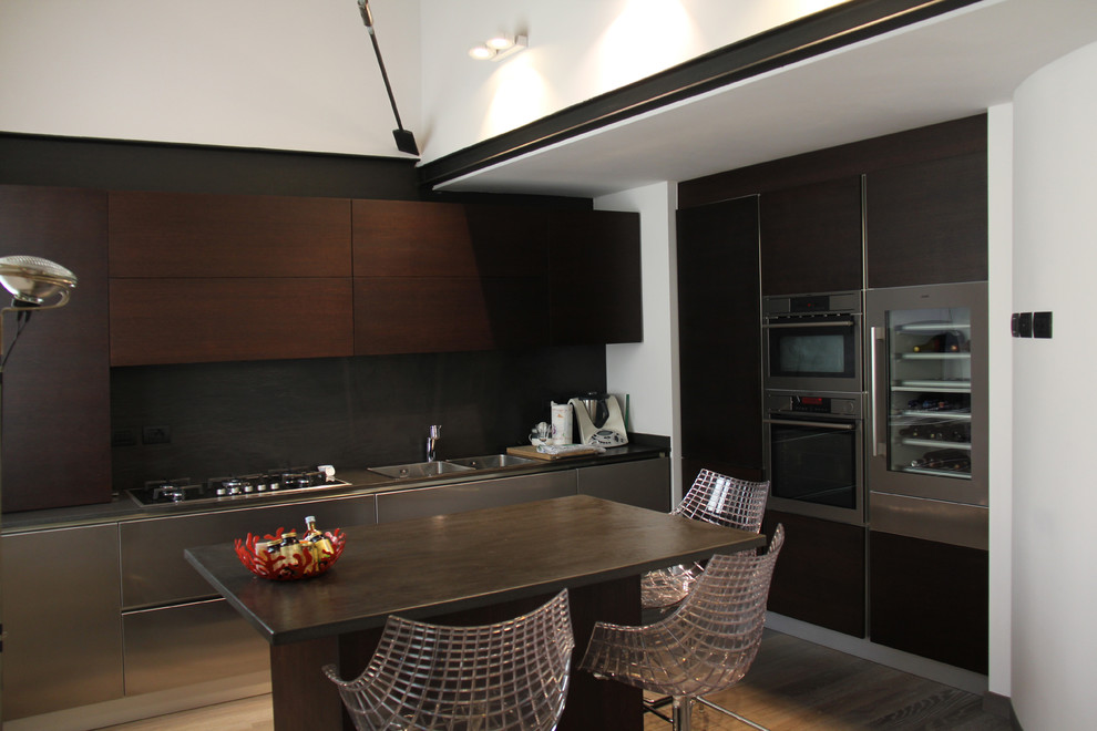Inspiration for a large contemporary l-shaped open plan kitchen in Milan with a double-bowl sink, flat-panel cabinets, dark wood cabinets, marble worktops, grey splashback, porcelain splashback, stainless steel appliances, medium hardwood flooring, an island and brown floors.