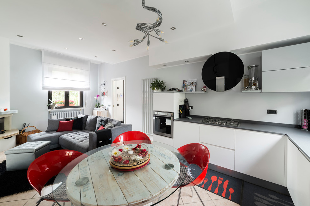 Open concept kitchen - small contemporary l-shaped ceramic tile open concept kitchen idea in Milan with an integrated sink, flat-panel cabinets, light wood cabinets, quartz countertops, gray backsplash and stainless steel appliances