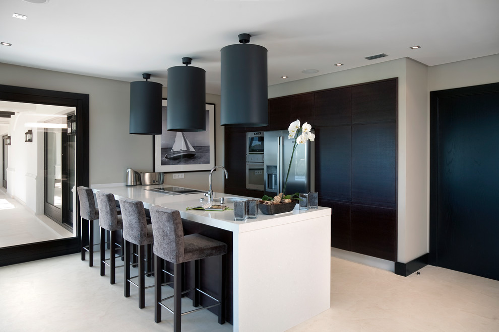 Kitchen - contemporary beige floor kitchen idea in Milan with an undermount sink, flat-panel cabinets, black cabinets, stainless steel appliances, a peninsula and white countertops