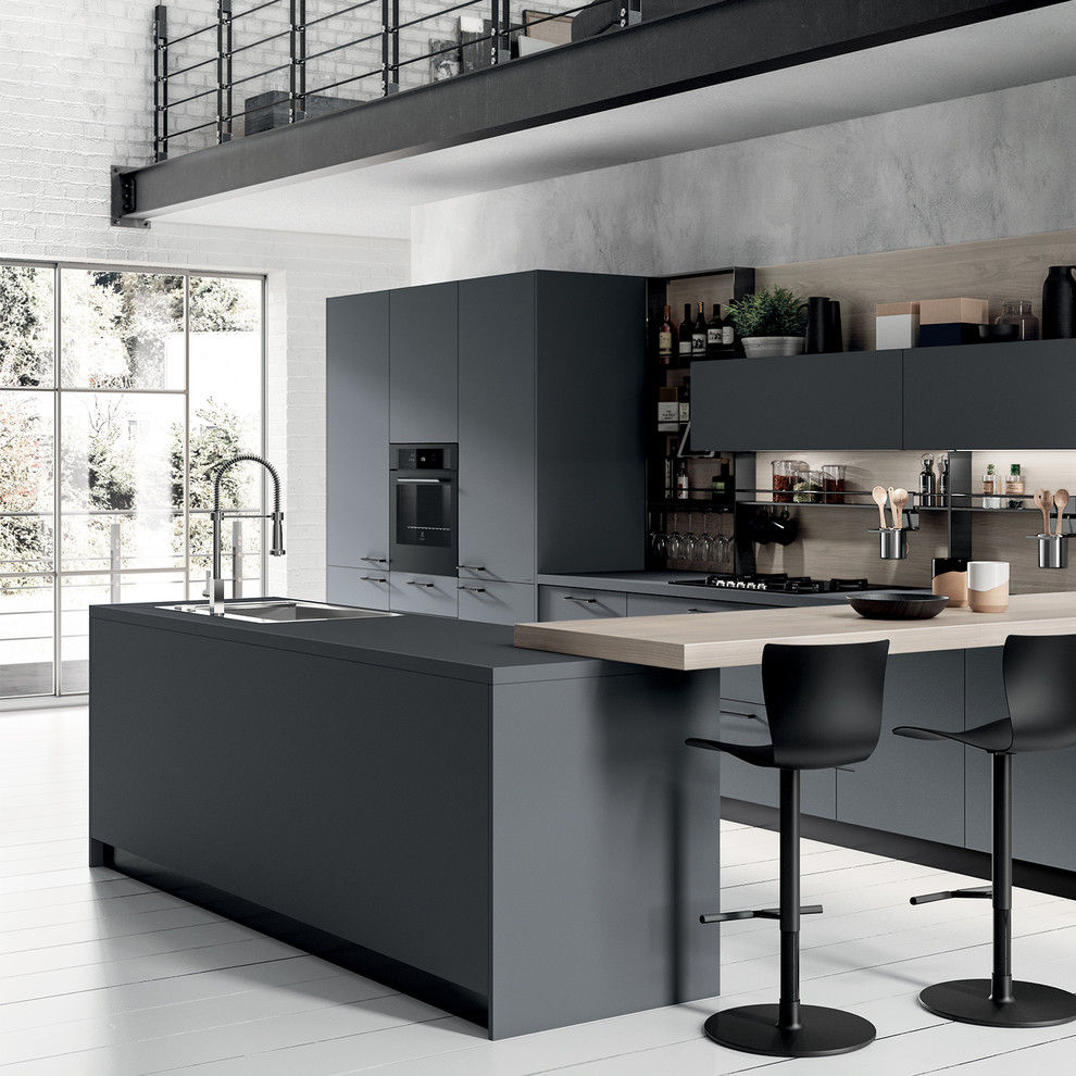 Immagine di una grande cucina minimalista con lavello a vasca singola, ante lisce, ante grigie, top in laminato e top grigio