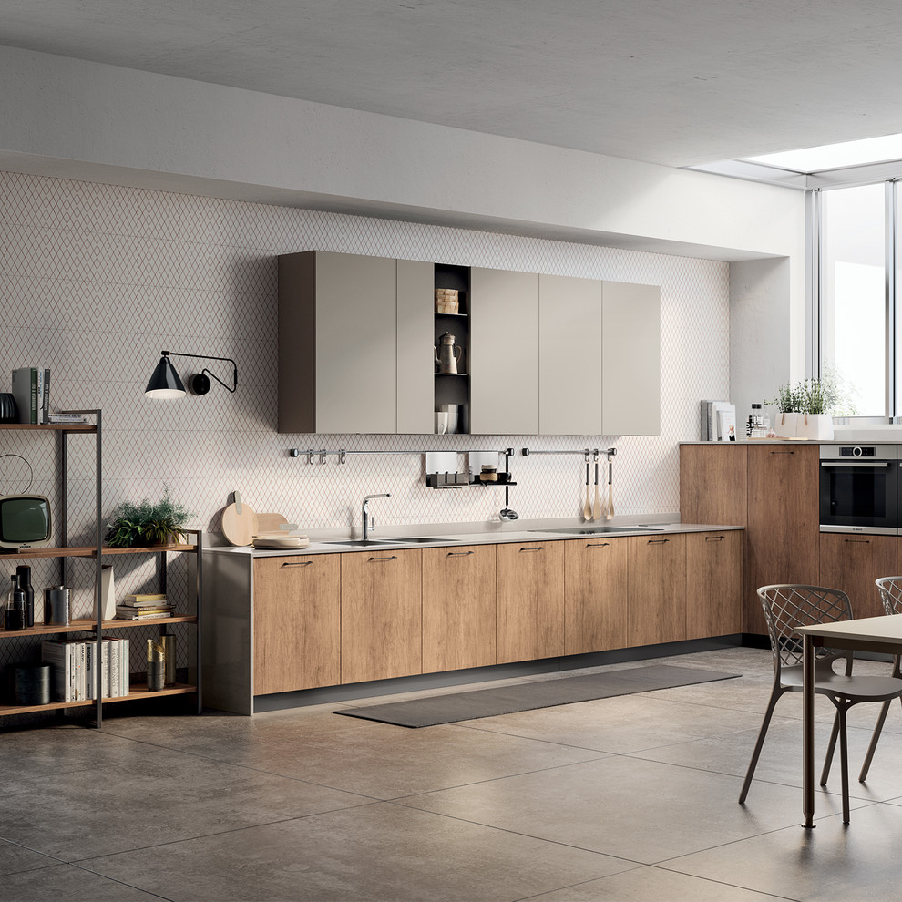Example of a mid-sized minimalist l-shaped open concept kitchen design in Other with a double-bowl sink, flat-panel cabinets, quartz countertops, stainless steel appliances, no island and gray countertops