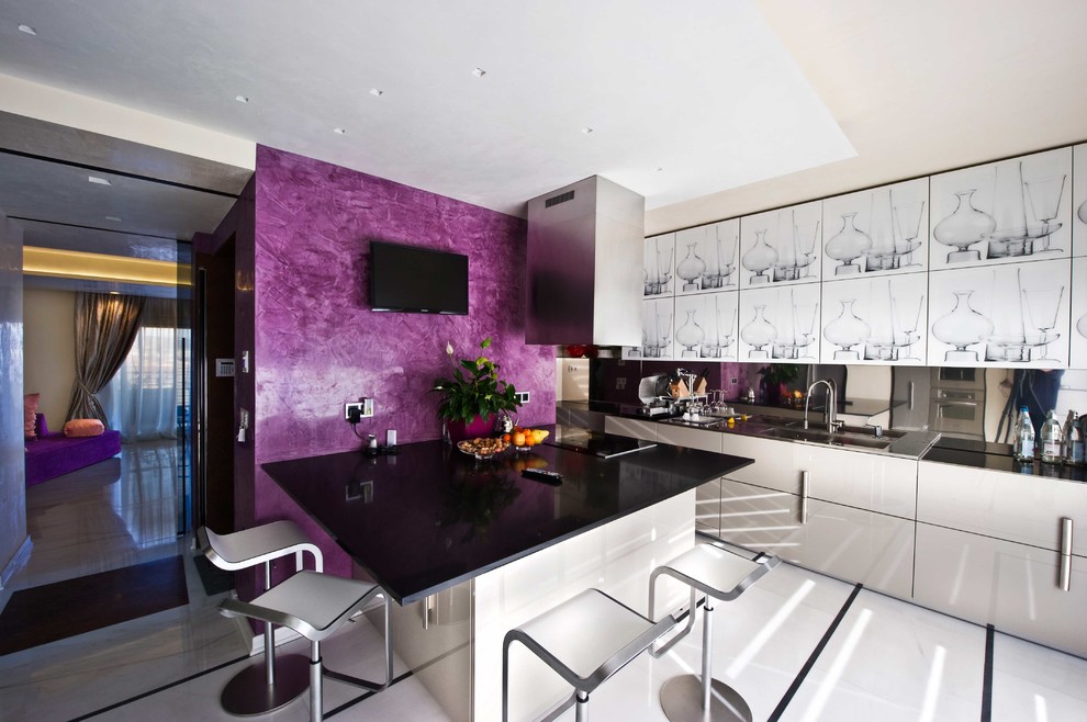 Photo of a contemporary grey and purple single-wall kitchen/diner in Venice with an integrated sink, flat-panel cabinets, white cabinets, marble worktops, an island and white floors.