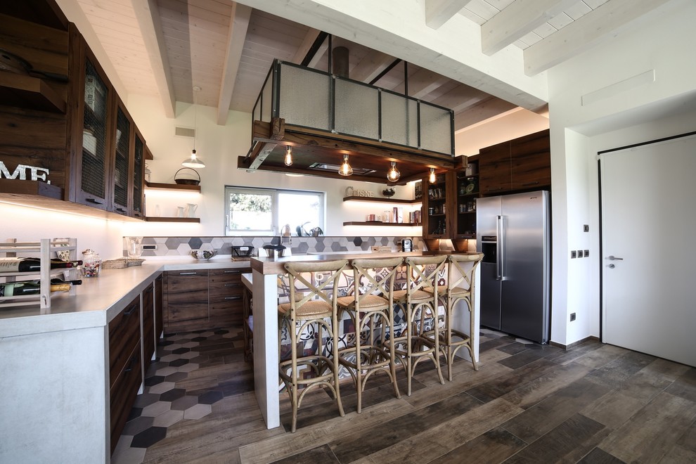 Large urban u-shaped porcelain tile and multicolored floor eat-in kitchen photo in Bologna with a double-bowl sink, distressed cabinets, concrete countertops, multicolored backsplash, cement tile backsplash, stainless steel appliances, an island, gray countertops and flat-panel cabinets