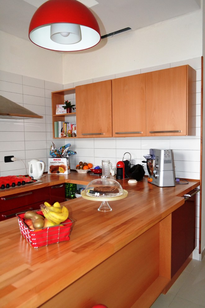 This is an example of a contemporary kitchen in Other with a double-bowl sink, flat-panel cabinets, light wood cabinets, wood worktops, white splashback, matchstick tiled splashback, stainless steel appliances and a breakfast bar.