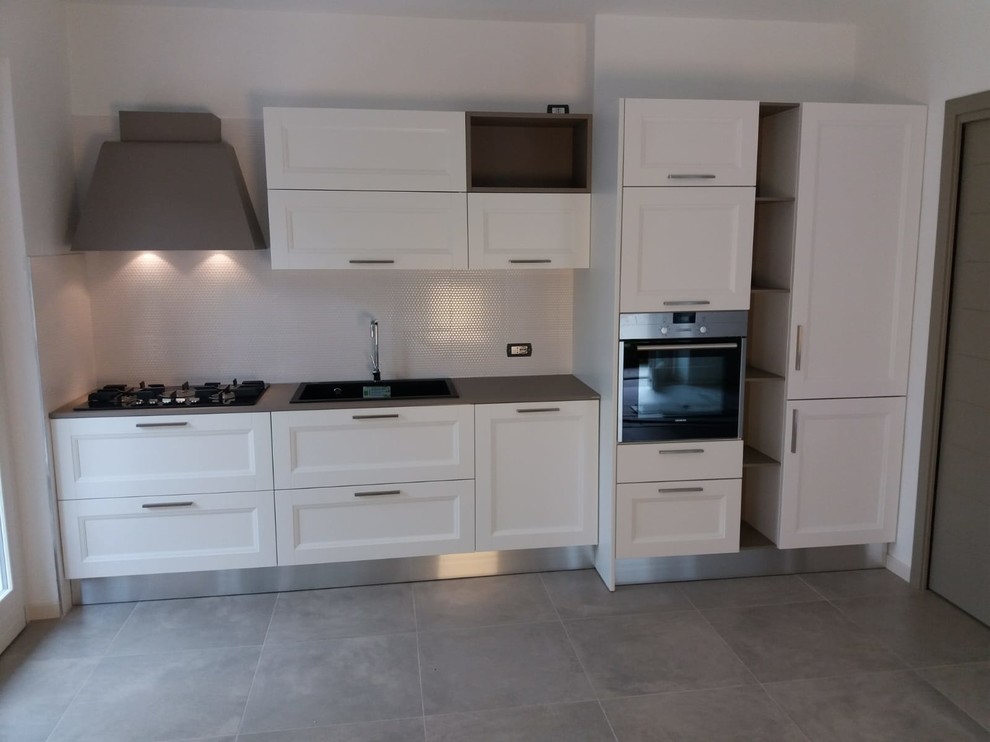 Photo of a traditional single-wall kitchen/diner in Other with no island and grey worktops.