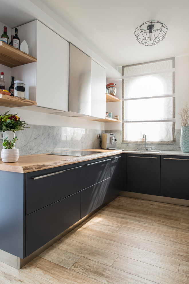 Medium sized contemporary l-shaped open plan kitchen in Other with a single-bowl sink, flat-panel cabinets, grey cabinets, wood worktops, grey splashback, marble splashback, stainless steel appliances, porcelain flooring, no island and beige floors.