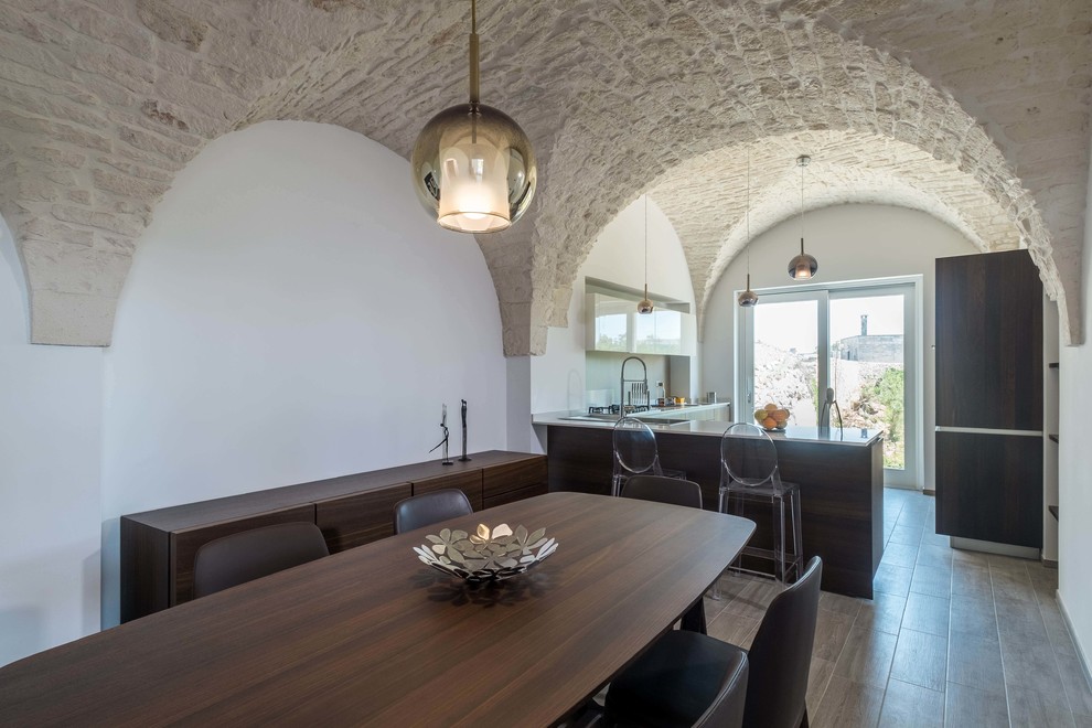 Example of a tuscan dining room design in Bari