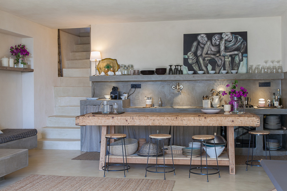 Photo of a medium sized urban single-wall open plan kitchen in Catania-Palermo with open cabinets, grey cabinets, concrete worktops and grey splashback.