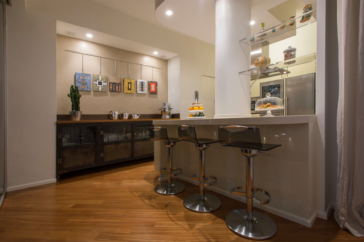 Inspiration for a contemporary medium tone wood floor and brown floor home bar remodel in Rome