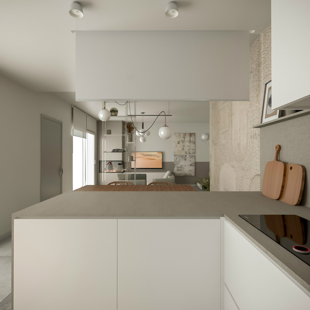 Foto di una cucina minimalista di medie dimensioni con ante lisce, ante bianche, top in superficie solida, pavimento in gres porcellanato, nessuna isola e pavimento grigio