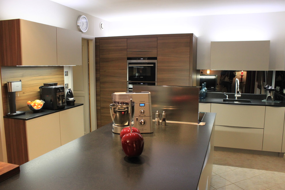 Photo of a large contemporary open plan kitchen in Nancy with a submerged sink, granite worktops, mirror splashback, stainless steel appliances and an island.