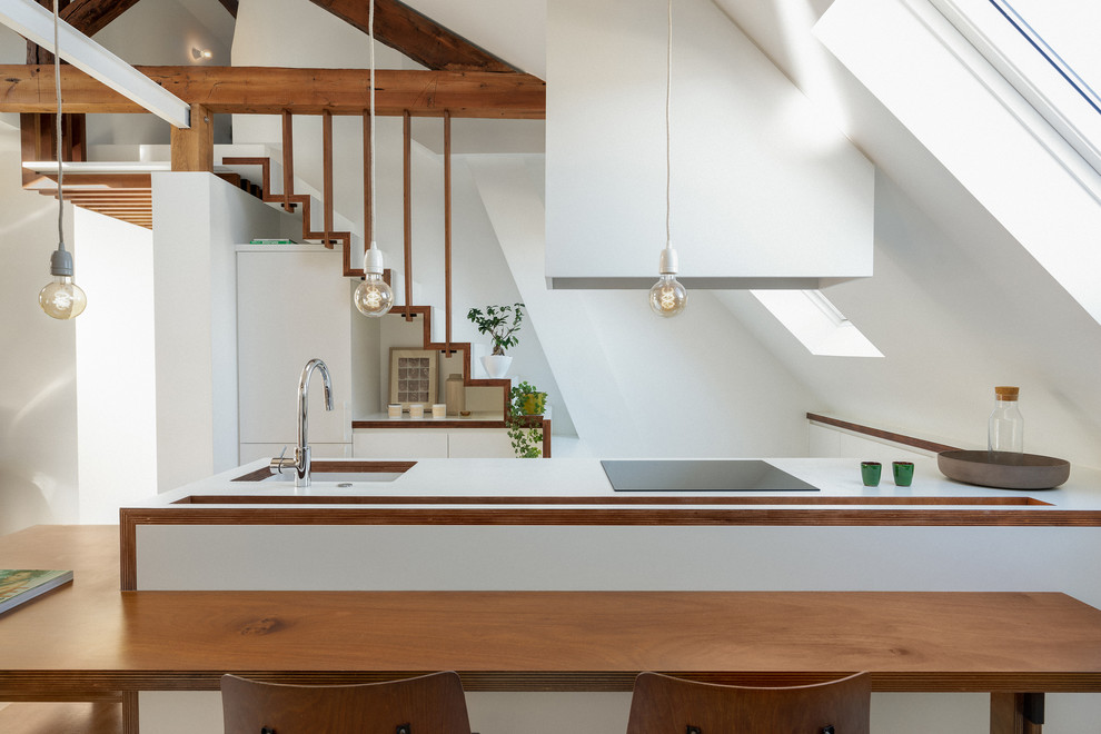 Источник вдохновения для домашнего уюта: кухня-гостиная среднего размера в скандинавском стиле с одинарной мойкой, плоскими фасадами, белыми фасадами, островом и белой столешницей