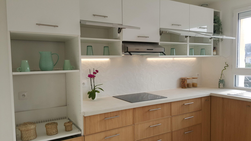 Medium sized contemporary l-shaped open plan kitchen in Paris with a double-bowl sink, glass-front cabinets, light wood cabinets, laminate countertops, white splashback, porcelain splashback, stainless steel appliances, ceramic flooring, no island, grey floors and beige worktops.