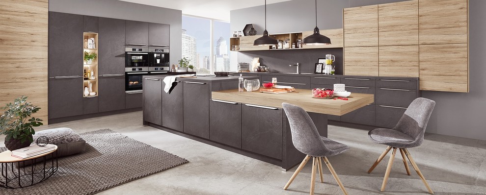 Design ideas for an expansive contemporary u-shaped open plan kitchen in Angers with grey cabinets, grey splashback, stainless steel appliances, concrete flooring, an island and grey floors.