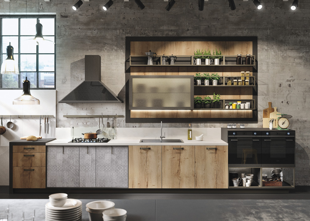 Mid-sized urban l-shaped painted wood floor open concept kitchen photo in Marseille with an integrated sink, glass-front cabinets, light wood cabinets, concrete countertops, gray backsplash, cement tile backsplash, black appliances and an island