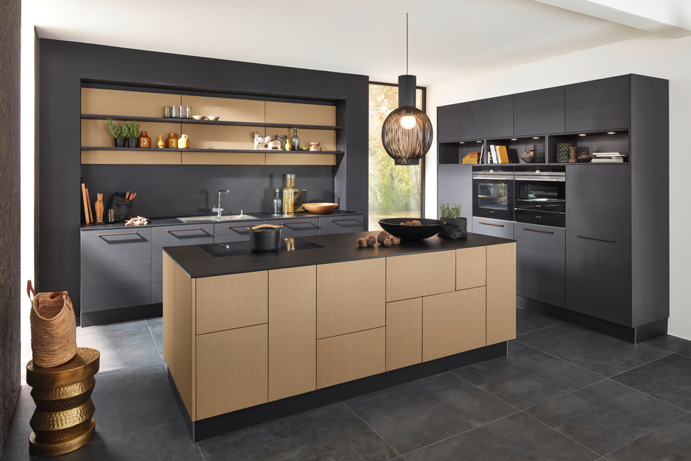 Inspiration for a medium sized modern grey and black galley kitchen/diner in Marseille with a submerged sink, flat-panel cabinets, dark wood cabinets, laminate countertops, integrated appliances, concrete flooring and an island.