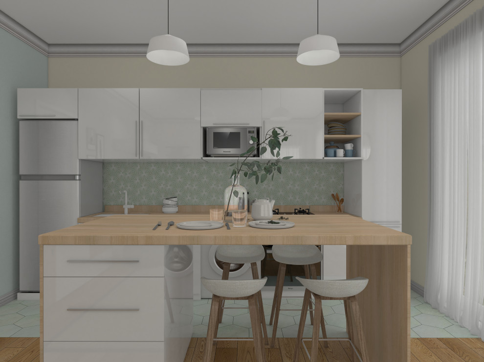 Idéer för att renovera ett litet minimalistiskt beige linjärt beige kök med öppen planlösning, med en undermonterad diskho, luckor med profilerade fronter, vita skåp, träbänkskiva, grönt stänkskydd, stänkskydd i cementkakel, rostfria vitvaror, cementgolv, en köksö och grönt golv