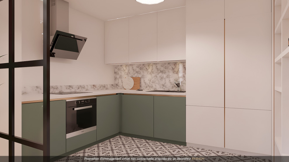 Foto di una cucina a L minimalista con lavello sottopiano, paraspruzzi in marmo, elettrodomestici da incasso, pavimento in cementine e top bianco