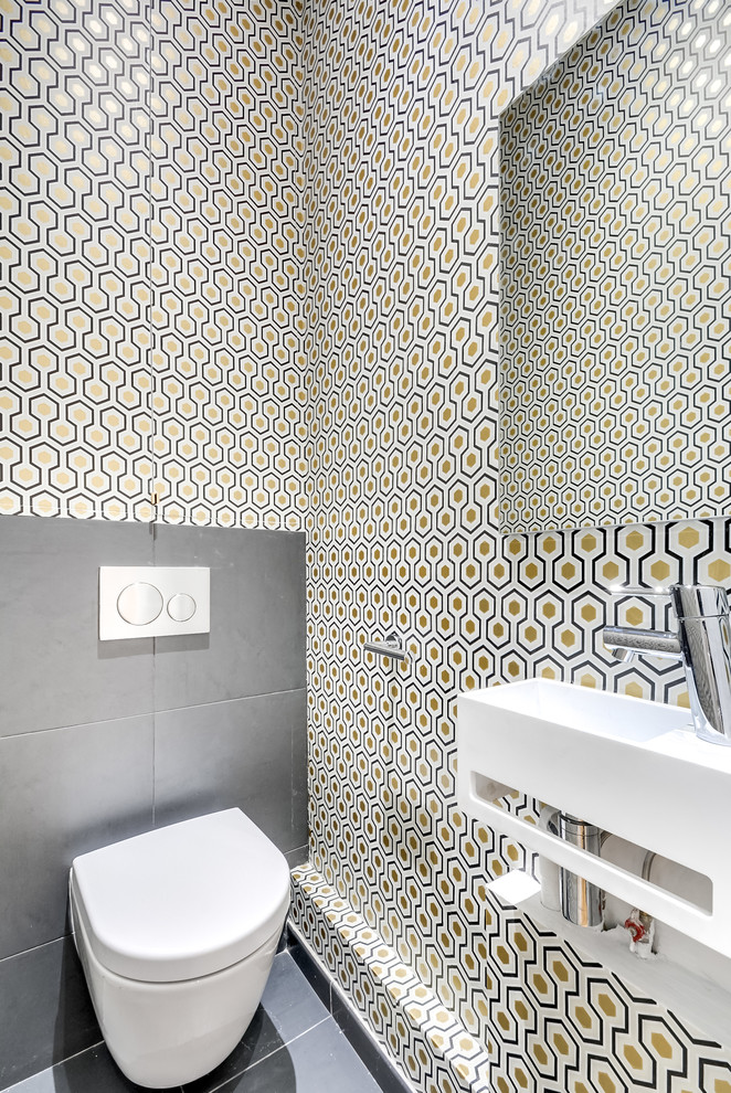Example of a transitional powder room design in Paris