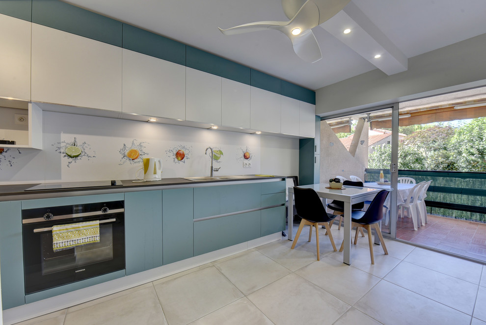 Photo of a small contemporary single-wall open plan kitchen in Toulouse with an integrated sink, beaded cabinets, turquoise cabinets, laminate countertops, white splashback, metal splashback, black appliances, ceramic flooring, no island, beige floors and black worktops.