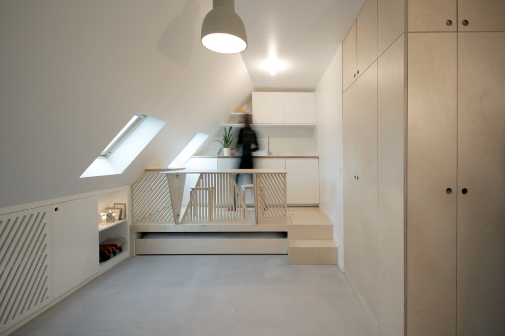 Foto di una piccola cucina design con pavimento in cemento