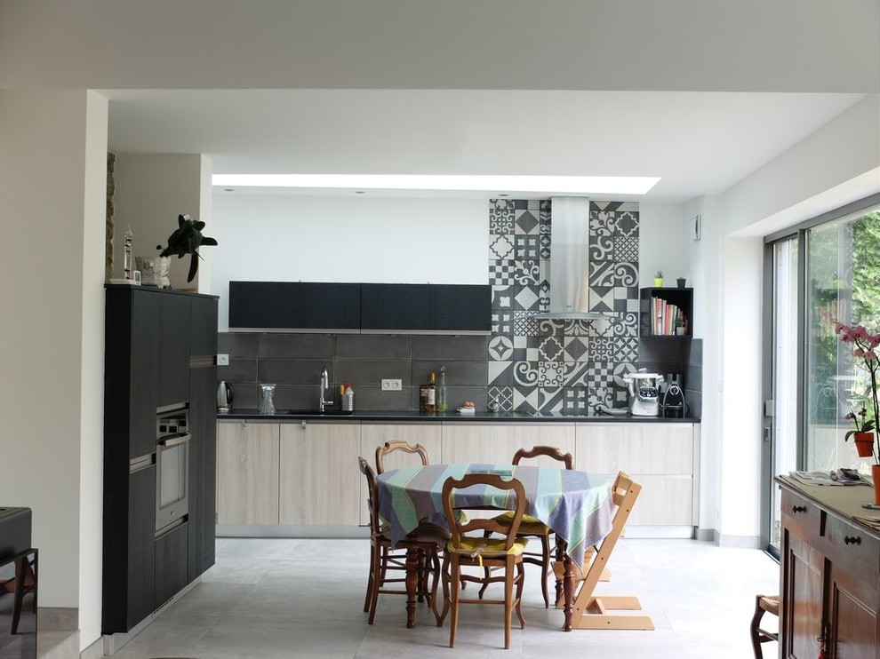 Photo of a kitchen in Rennes with ceramic flooring.