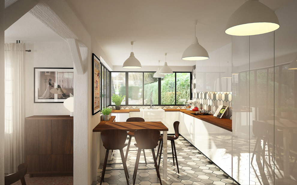 Une cuisine contemporaine ouverte sur la salle à manger - Contemporary
