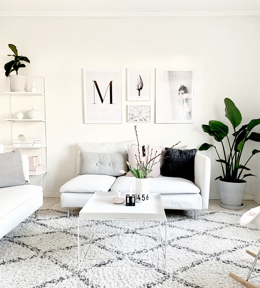 Scandinavian living room in Aalborg with white walls and no fireplace.