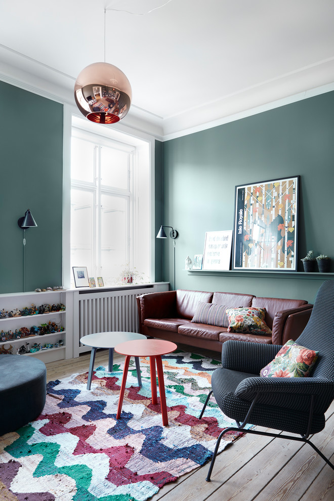 Danish living room photo in Copenhagen with green walls