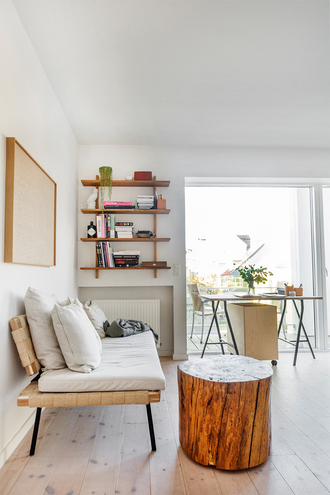 Mid-sized danish enclosed light wood floor and beige floor living room photo with white walls and no fireplace