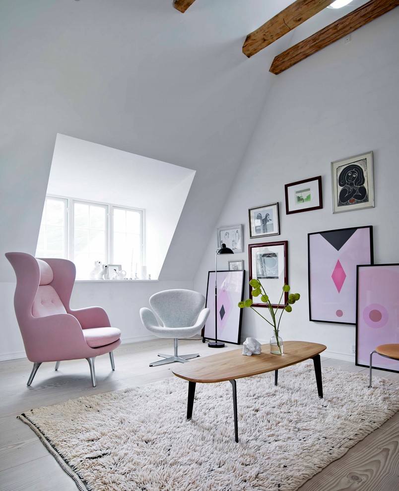 Inspiration for a mid-sized scandinavian formal and open concept light wood floor living room remodel in Copenhagen with white walls and no tv