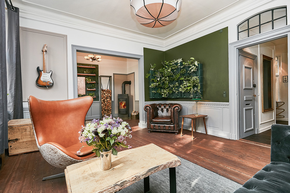 Eclectic living room photo in Copenhagen with green walls