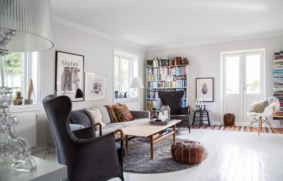 Living room - mid-sized scandinavian formal and enclosed painted wood floor living room idea in Copenhagen with white walls, no fireplace and no tv