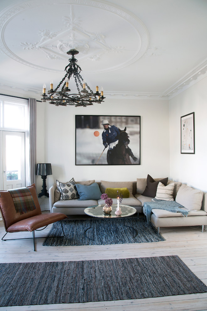 Large danish formal and enclosed light wood floor living room photo in Copenhagen with white walls, no fireplace and no tv