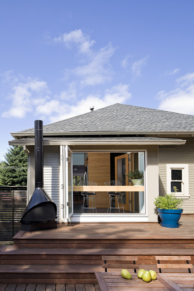 Example of a mid-sized trendy backyard deck design in San Francisco with a fire pit and no cover