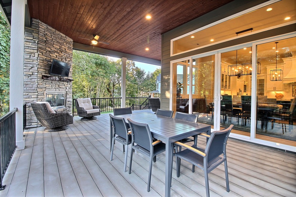 Photo of an expansive classic back terrace in Portland with feature lighting.