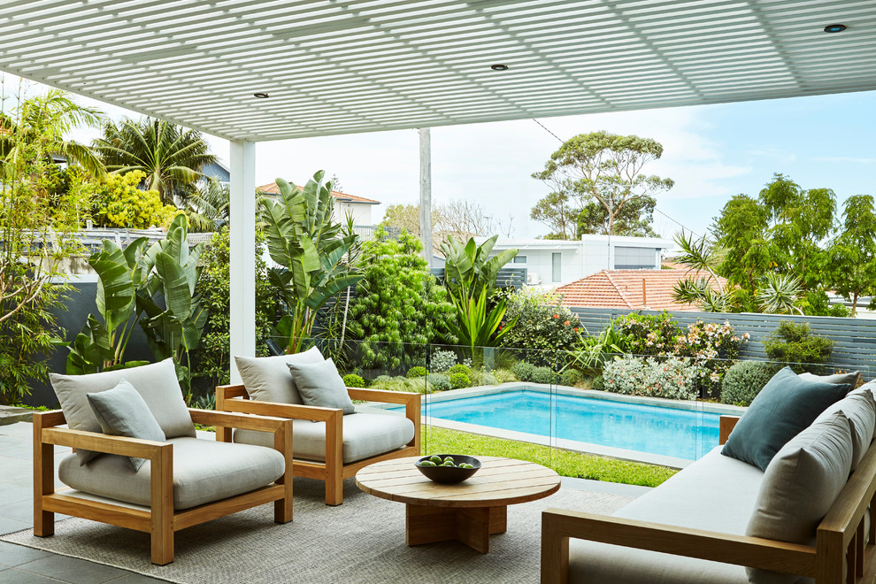 Design ideas for a contemporary back terrace in Sydney with an awning.