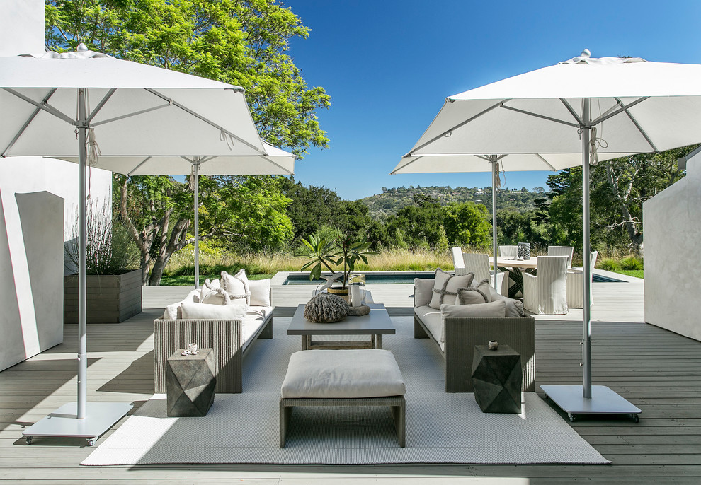 Example of a mid-sized trendy backyard deck design in Santa Barbara with no cover