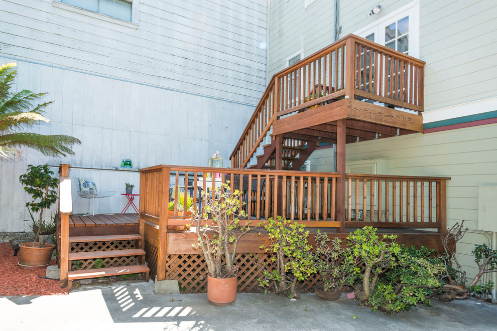 Example of a mid-sized eclectic backyard deck design in San Francisco with no cover