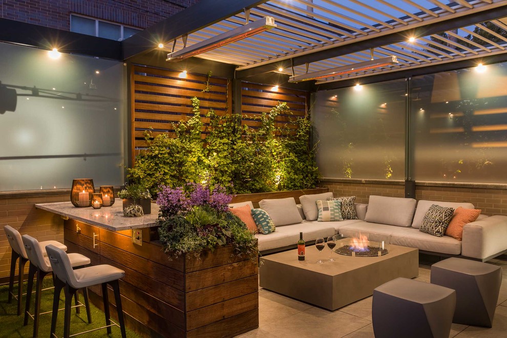 This is an example of a contemporary roof rooftop terrace in Chicago with a pergola and a bar area.