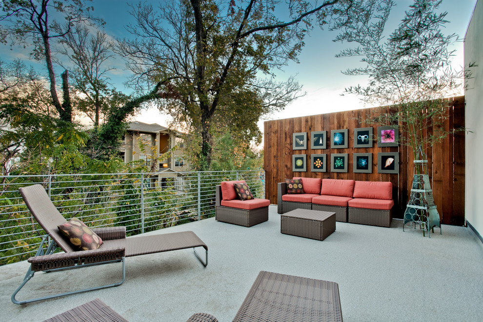 Photo of a contemporary back terrace in Dallas with no cover and fencing.