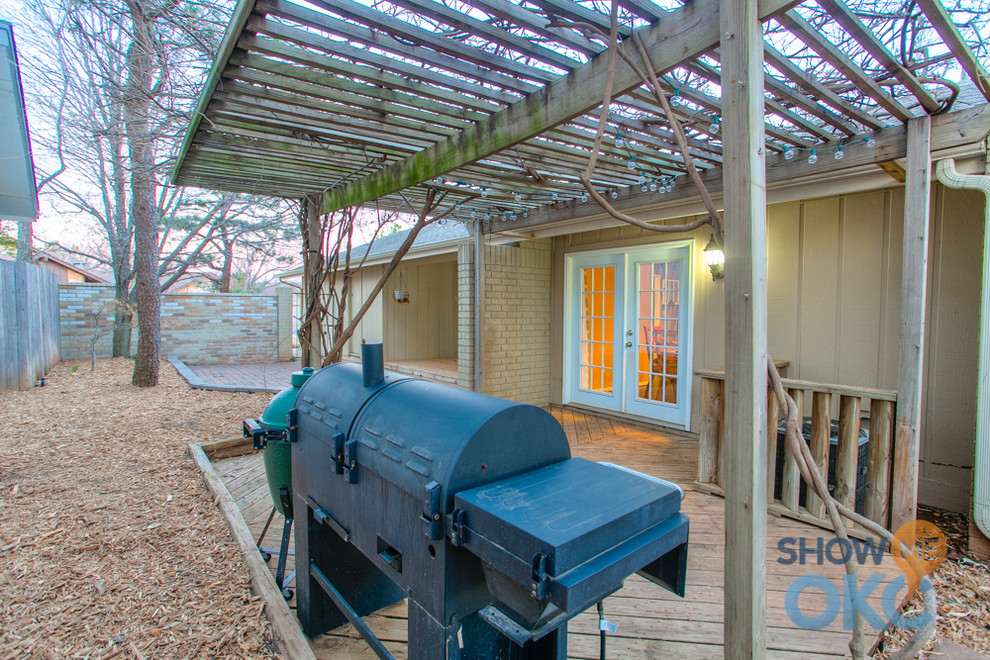 Industrial side terrace in Oklahoma City with a pergola.