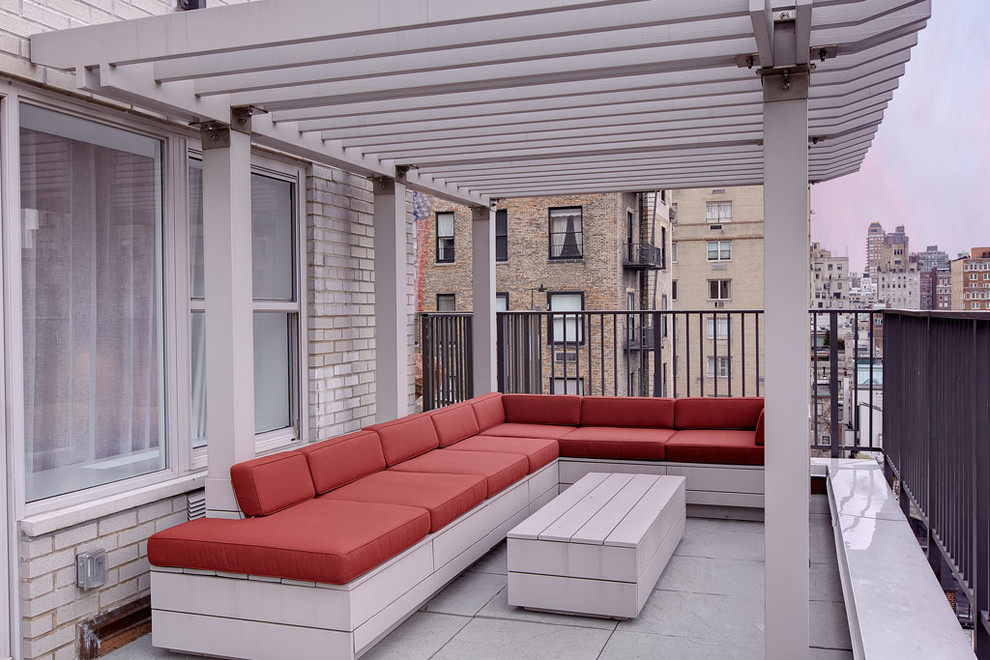 Deck - contemporary deck idea in New York with a pergola