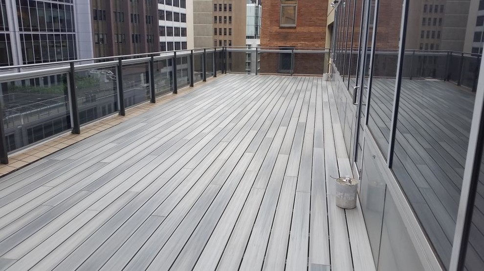 This is an example of a large modern roof terrace in Sydney with no cover.