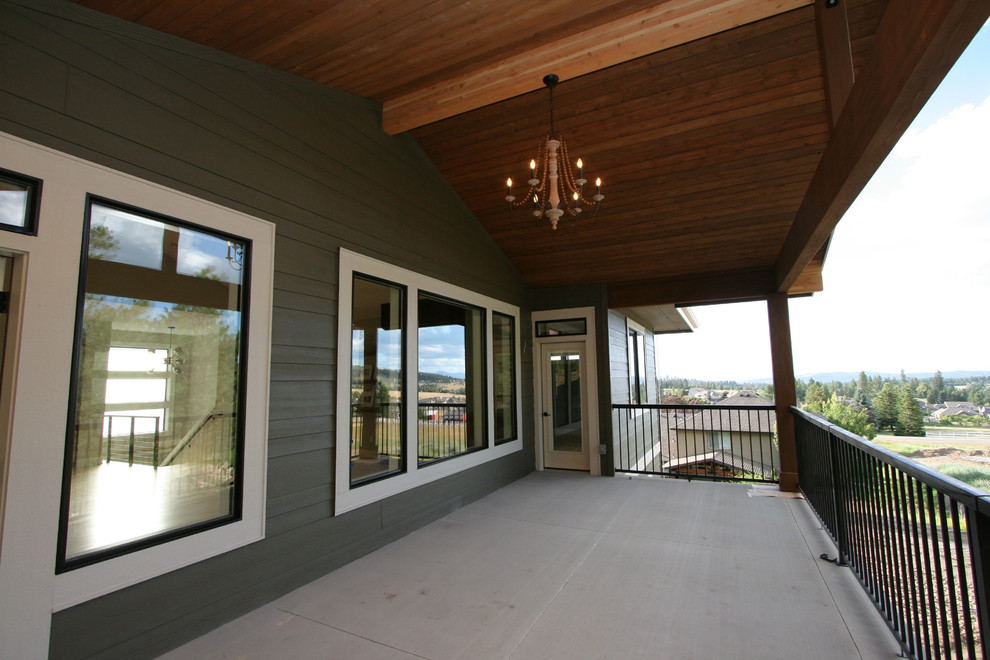 Inspiration for a medium sized contemporary back terrace in Seattle with a roof extension.