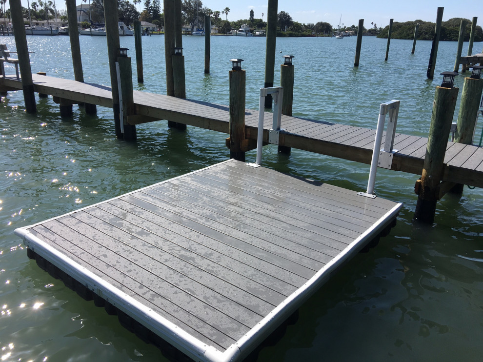 Small island style backyard dock photo in Tampa with no cover